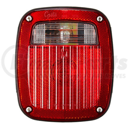 50952 by GROTE - Torsion Mount® Three-Stud Navistar® Volvo® Stop Tail Turn Light, LH w/ License Window, Red